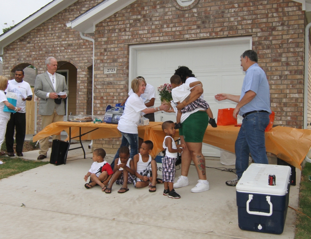 Lori handing the keys to the new owner of this home. Celanese sponsored the build of this Habitat for Humanity home.
